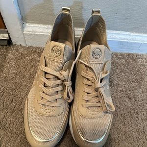 Brand new Michael Kors shoes never been worn. Too small for my feet.